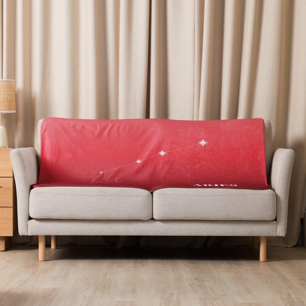 Aries Zodiac Blanket in Sunlit Carnelian in a lifestyle setting