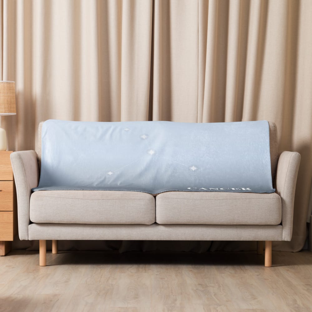 Cancer Zodiac Blanket in Luminous Periwinkle in a lifestyle setting